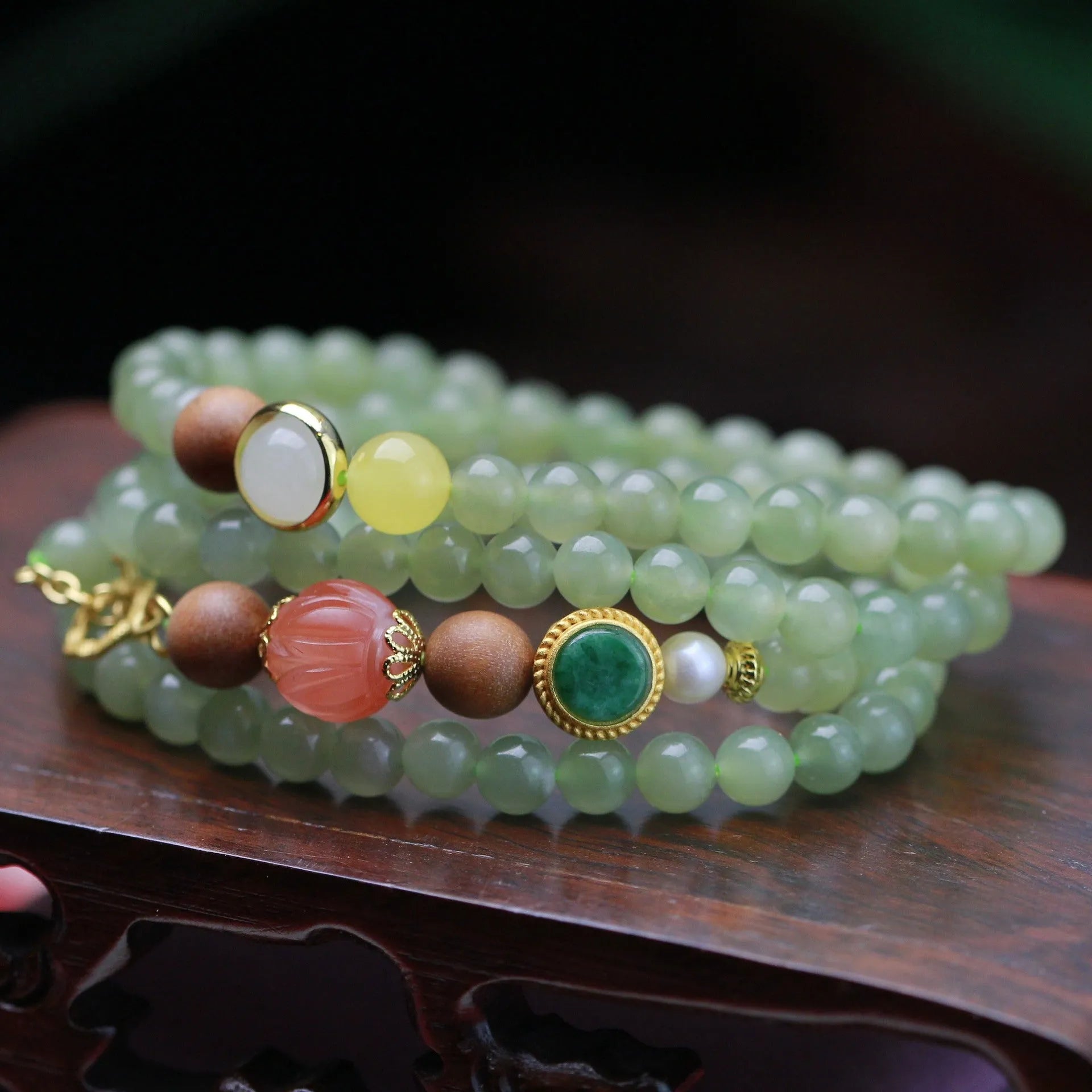 Hand-carved red Hetian Jade lotus bead necklace with white sandalwood beads, beeswax pendant, and zodiac charm.