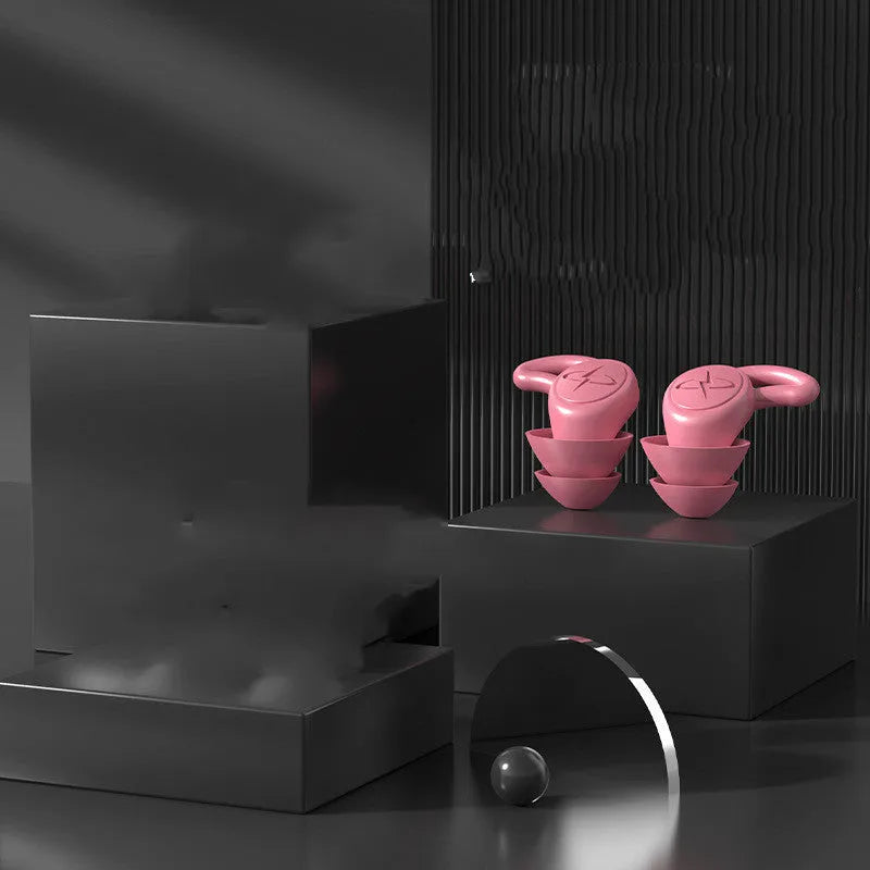 Pair of silicone noise reduction earplugs in black for sleep and sound insulation