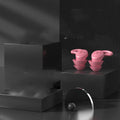 Pair of silicone noise reduction earplugs in black for sleep and sound insulation