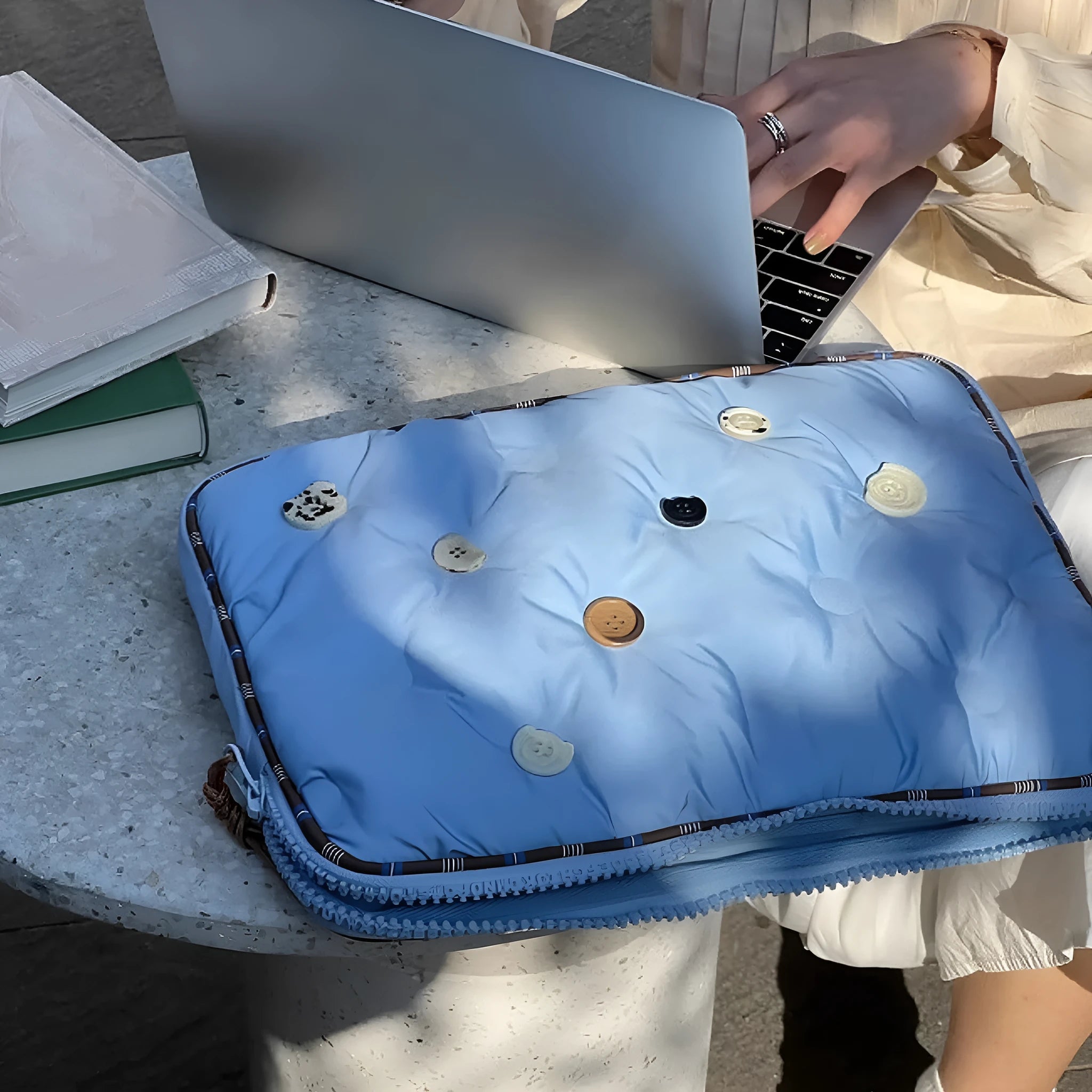 Blue and citrus hug plaid patterned nylon laptop protective case for 14-inch and 16-inch computers.