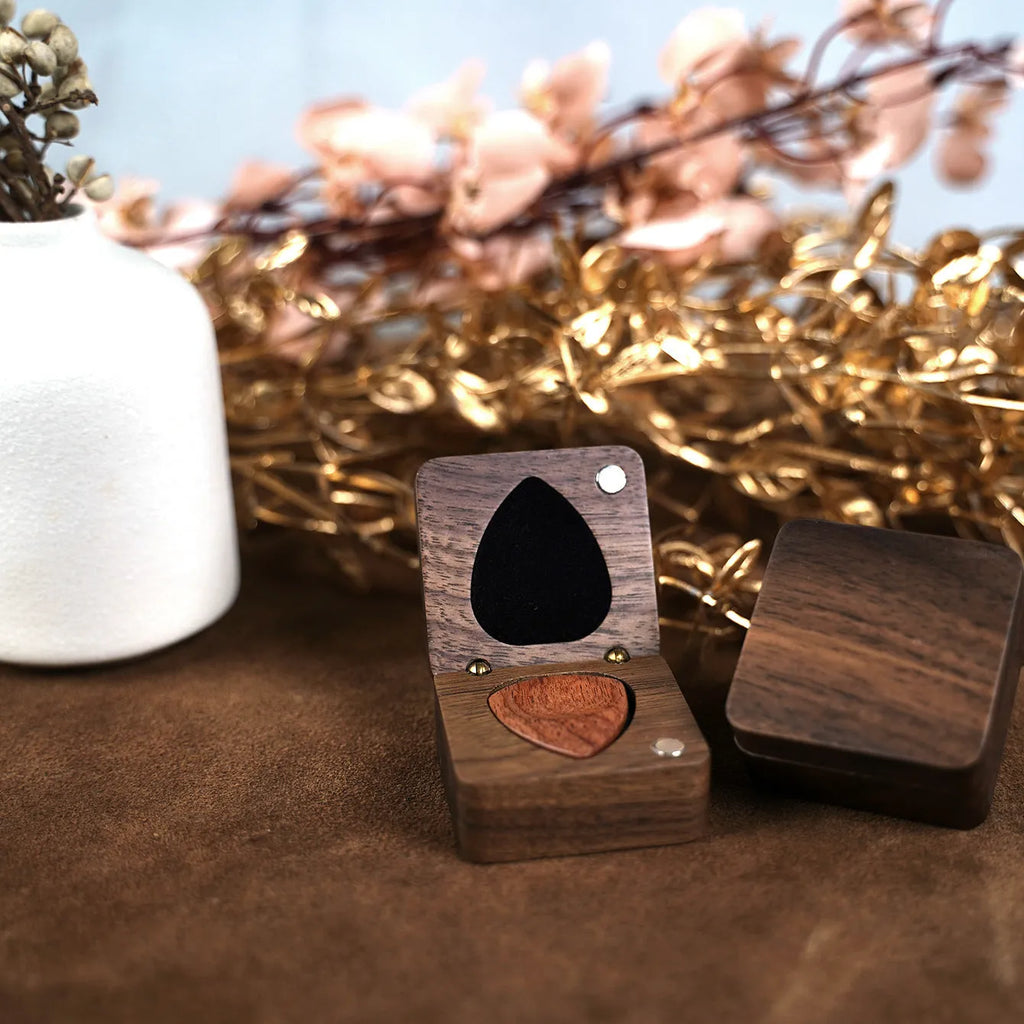 Wooden guitar pick box storage container made from Sapele wood with a brown finish