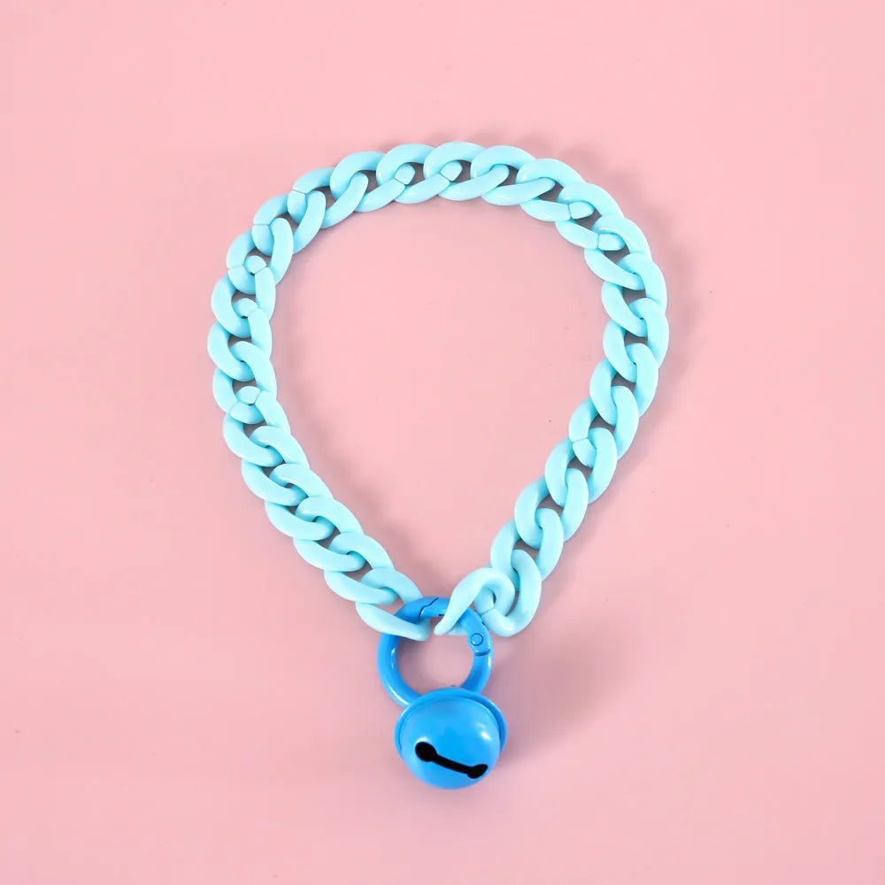 A plastic pet collar in macaron candy colours shown in blue, pink, and mixed variants, with a chain design and S/M size tags.