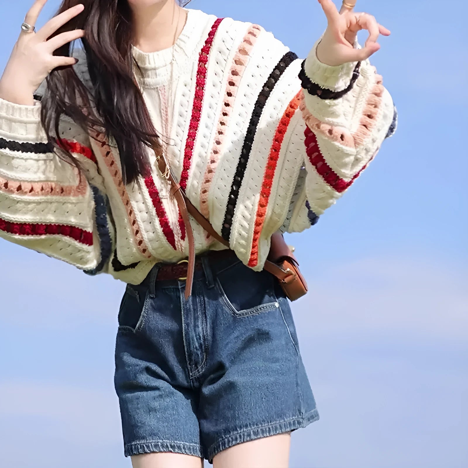 Rainbow striped round neck pullover sweater with batwing sleeves in loose fit casual style