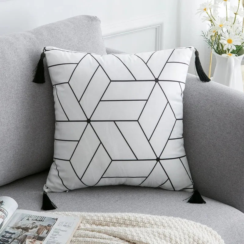 Bohemian national style throw pillow cushion cover in light grey on a sofa.