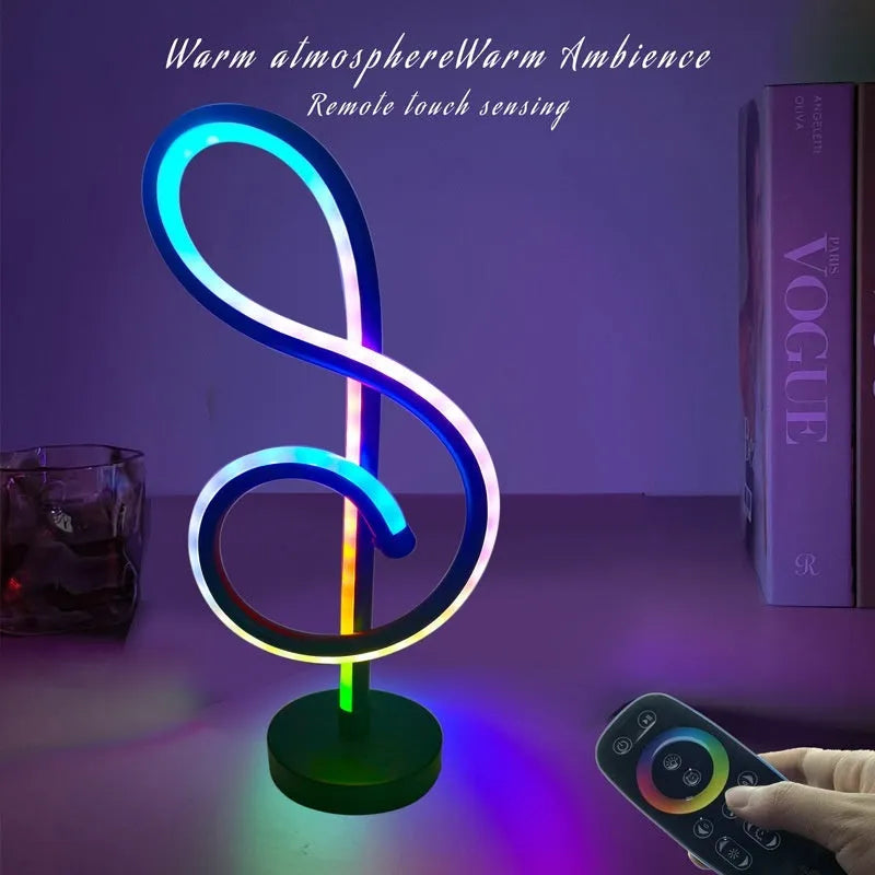 Black musical note shaped Bluetooth LED night light with remote control on a bedside table.