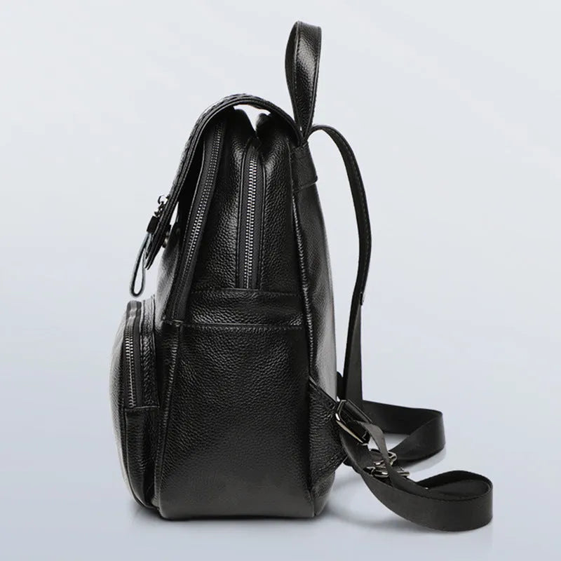 Solid colour genuine leather women's backpack showing blue and wine red options with internal compartments.