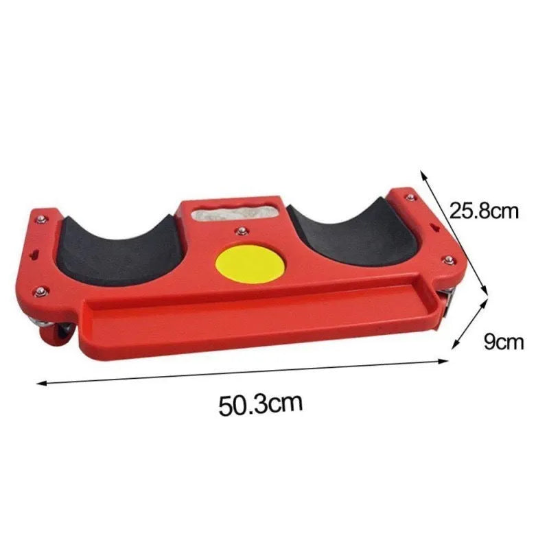 Blue car repair knee board with universal wheels and built-in knee pad on concrete garage floor