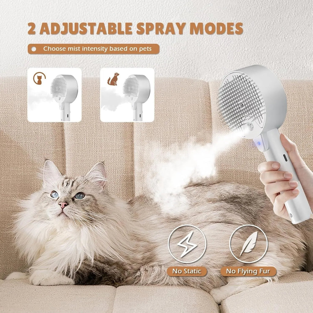 Pink and white cat steam brush with adjustable spray and rounded massage head for pet grooming