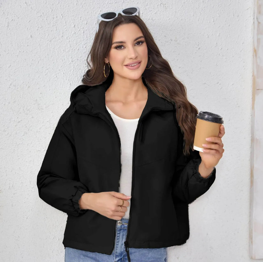 Women's hooded shell jacket in polyester available in grey, black, and purple with loose fit