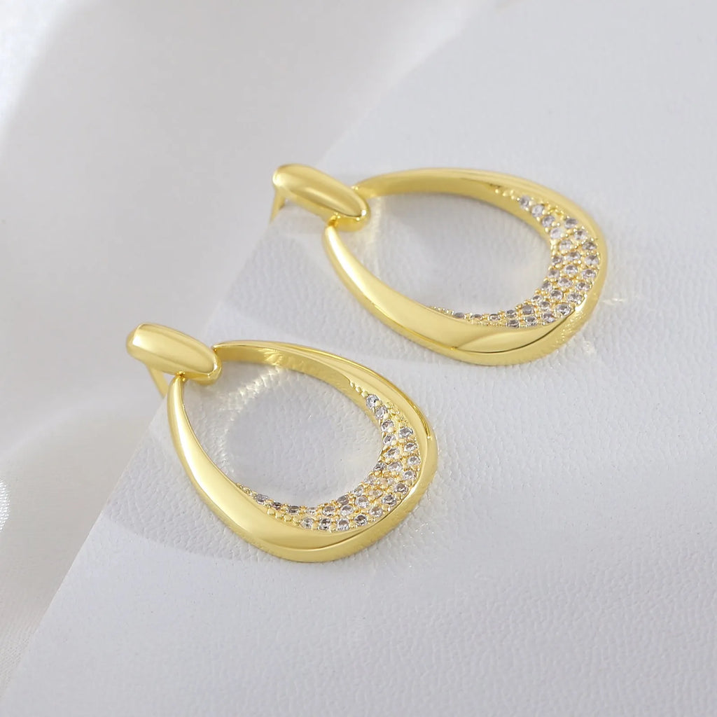 Yellow gold geometric ring drop earrings with electroplated finish on copper, 2.6 x 1.7 cm dimensions