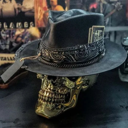 Handmade wool felt skull hat with a conical crown shape on a mannequin head.