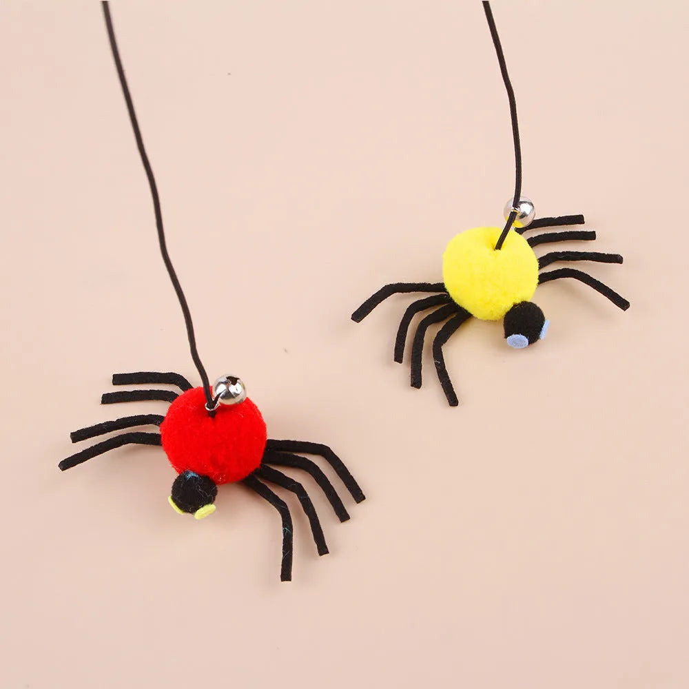 Red hanging door cat toy with elastic rope, feather, bell, and spider attachment