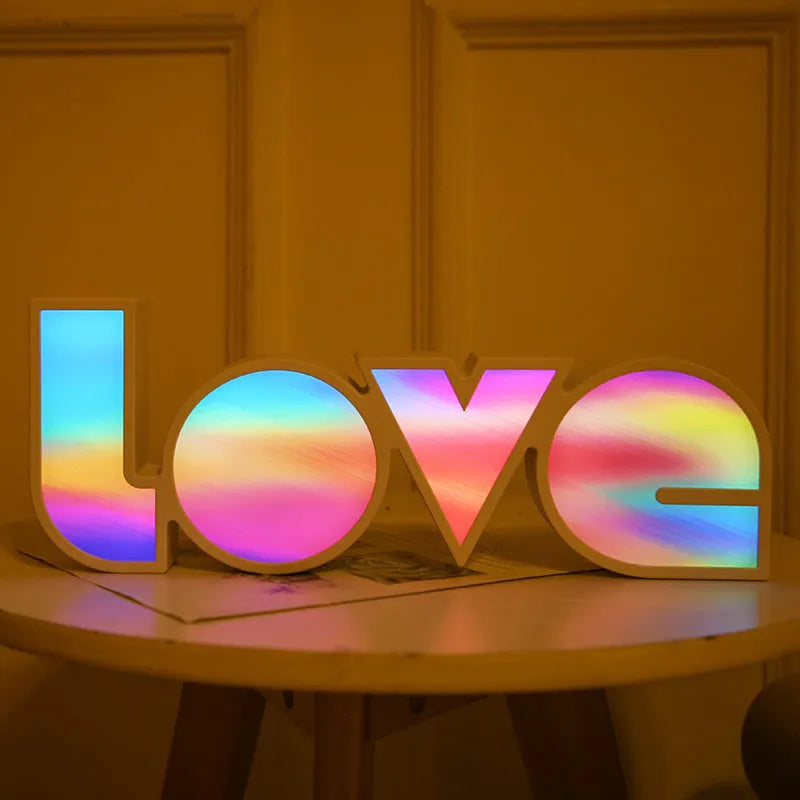 Rainbow style LOVE word LED decorative light with USB cable, measuring 35.5cm by 13.5cm.