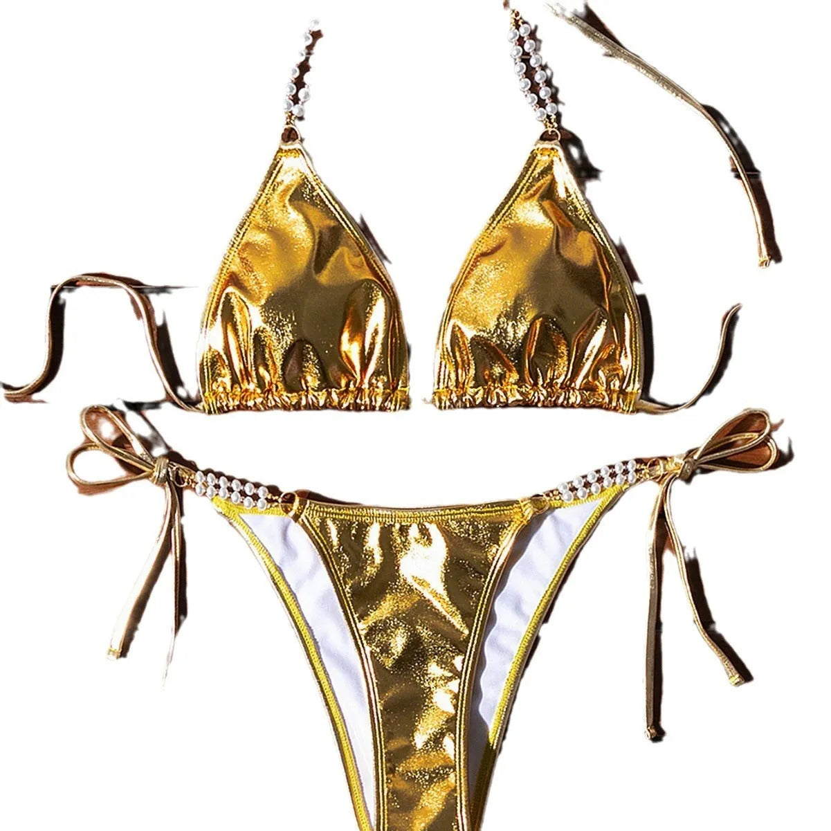 Gold halter neck bikini top with lace-up front and matching briefs, featuring pearl chain detail.