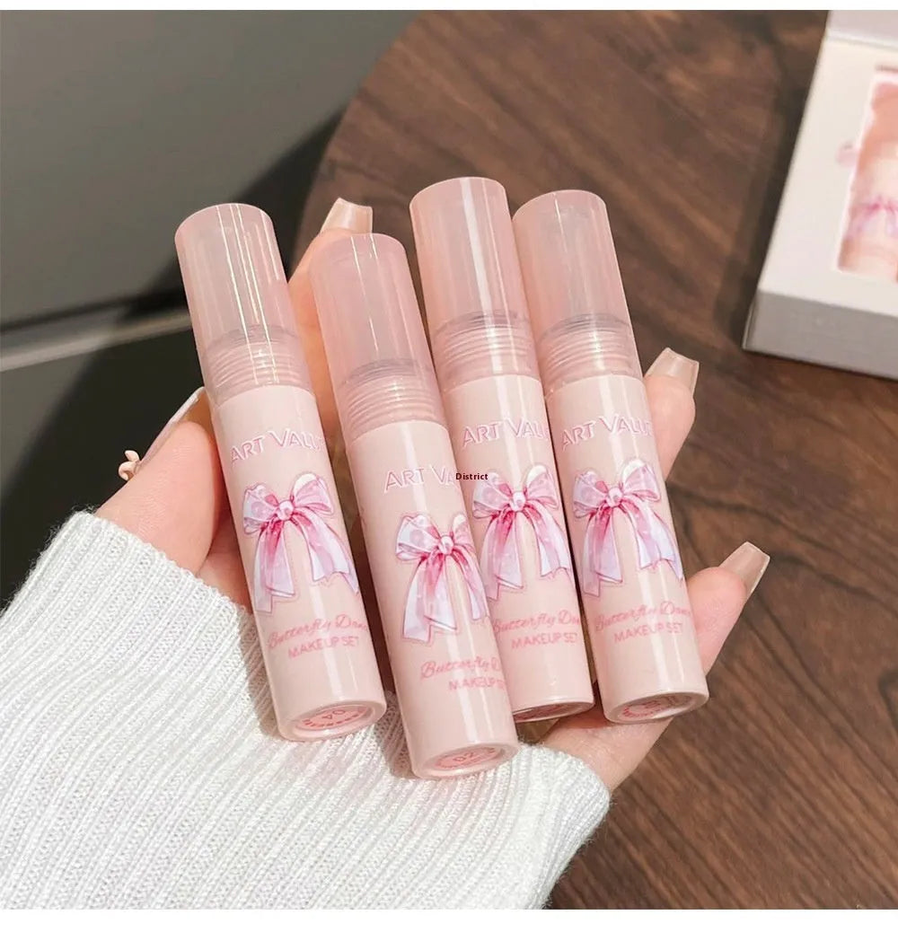 Butterfly Box pink makeup set with four matte lip muds, powder blusher, and necklace