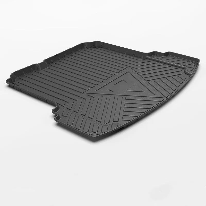 Black carbon fibre pattern TPE car boot liner mat for vehicle cargo protection.