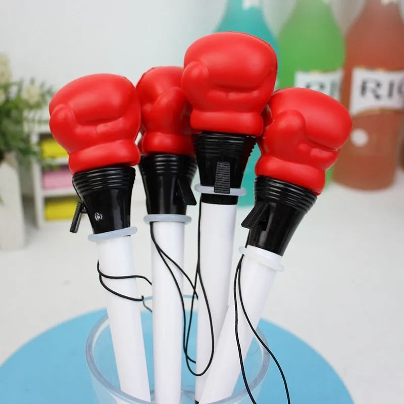 Four black pressure relief pens with boxing press ejection mechanism and 0.7mm bullet tips