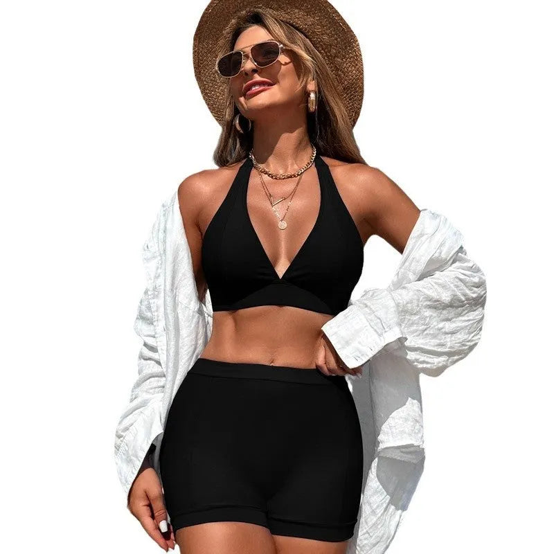 Women's black nylon bikini swimsuit on a hanger, Asian sizing.