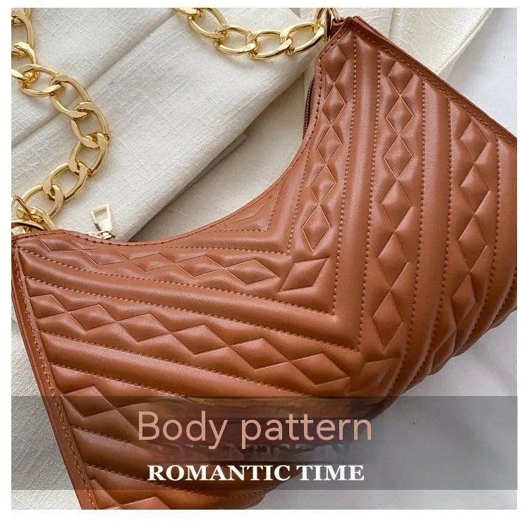 Brown pleated chain baguette shoulder bag showing vertical square shape and soft carry handle