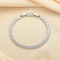 Rectangular brass women's bracelet with diamond zircon treatment in champagne gold colour