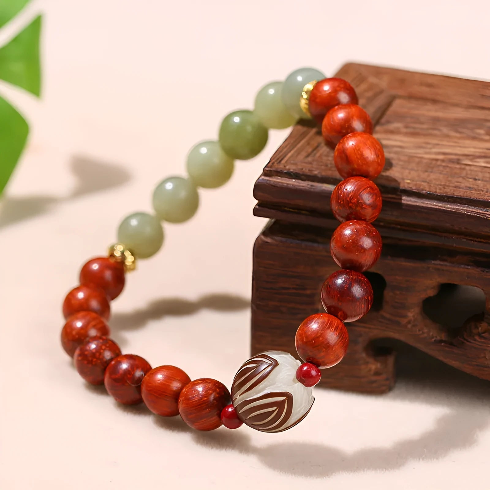 Red rosewood and grey jade Bodhi Lotus bracelet with geometric round beads.