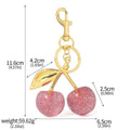 Zinc alloy cherry-shaped keychain pendant in red colour with three-dimensional design