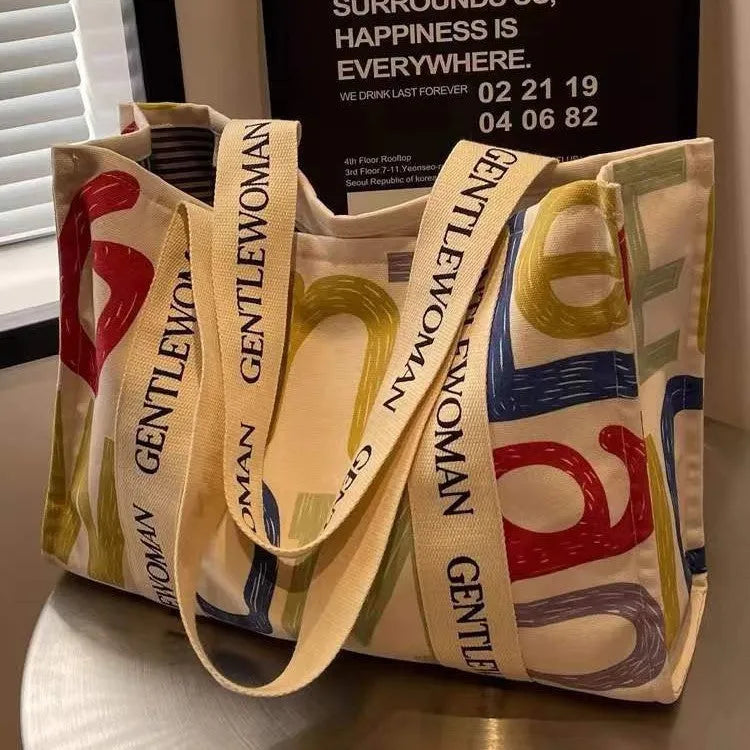 Canvas shoulder tote bag with printed design, large capacity for shopping and travel