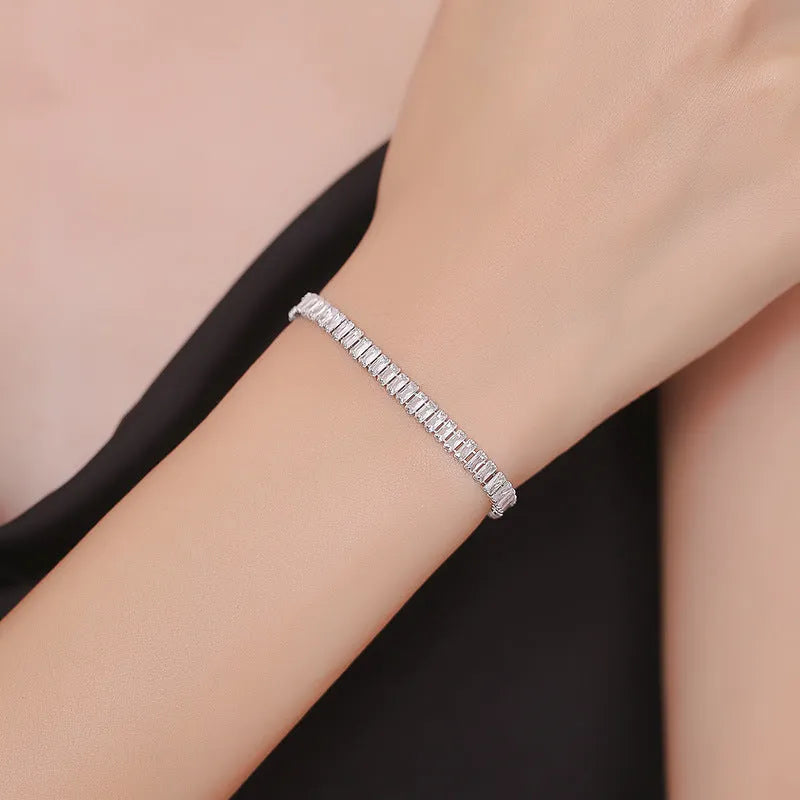 Rectangular brass women's bracelet with diamond zircon treatment in champagne gold colour