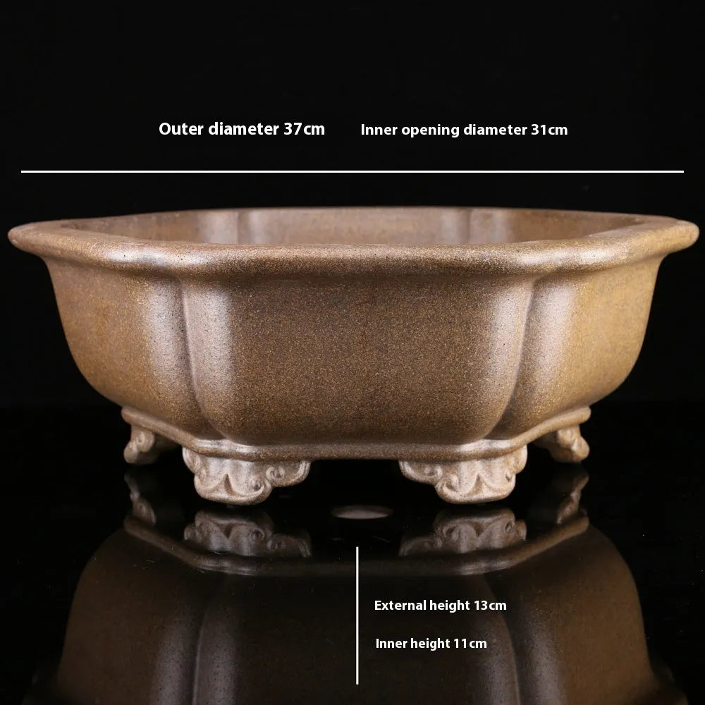 Handmade purple sand tea basin crafted from Pinus taiwanensis firewood clay in hexagonal or begonia styles
