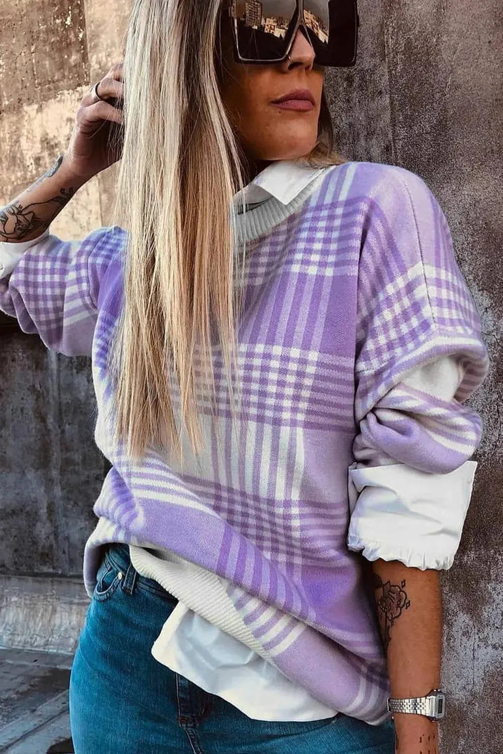 Lilac and white plaid print loose sweater with long sleeves and ribbed trim on cuffs and hem.