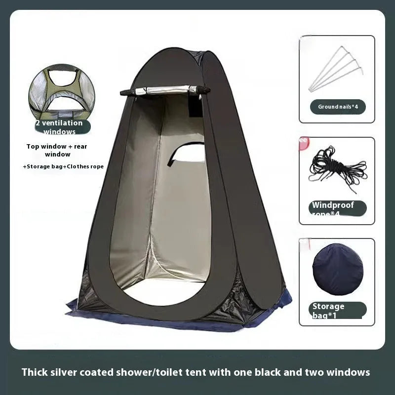 Blue and silver fast-opening camping changing tent set up outdoors with two windows.