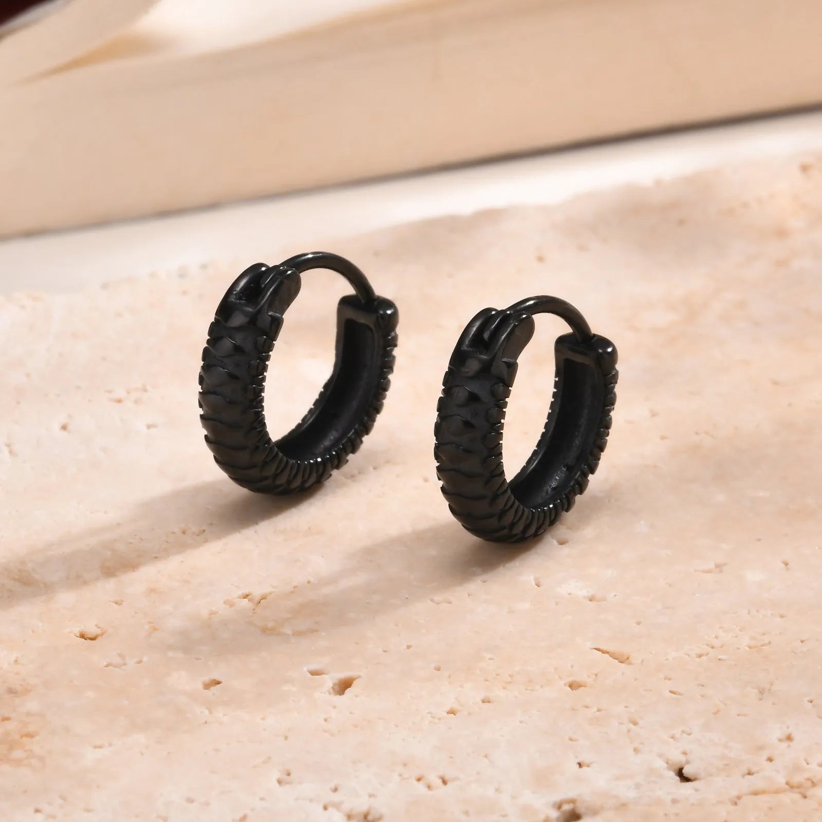 Stainless steel snake pattern drop earrings in black or gold colour
