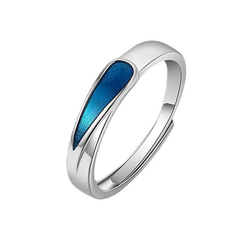 Blue tear drop shape copper ring on finger with glossy glue dripping finish