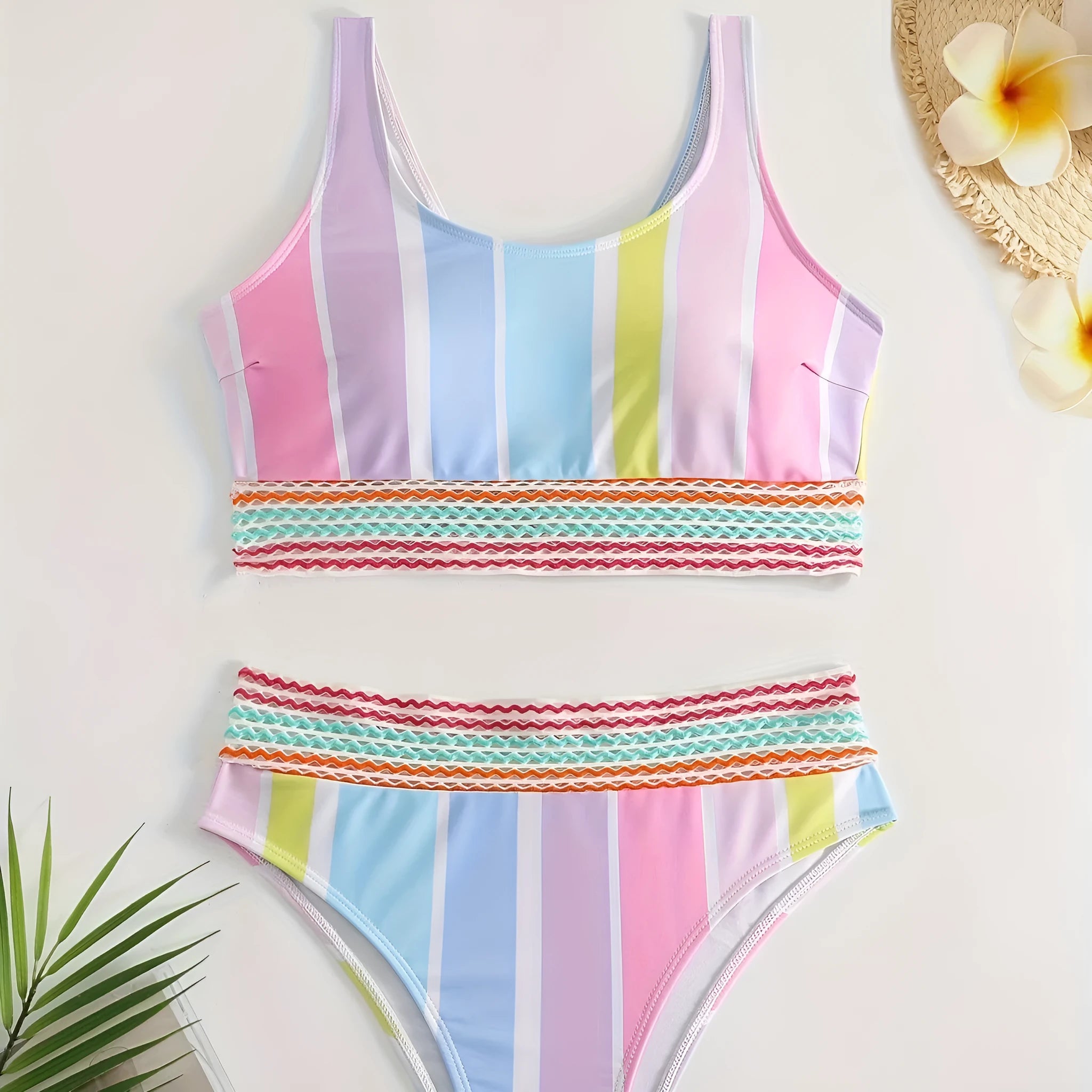 Striped women's bikini top and bottom set for sports swimming.