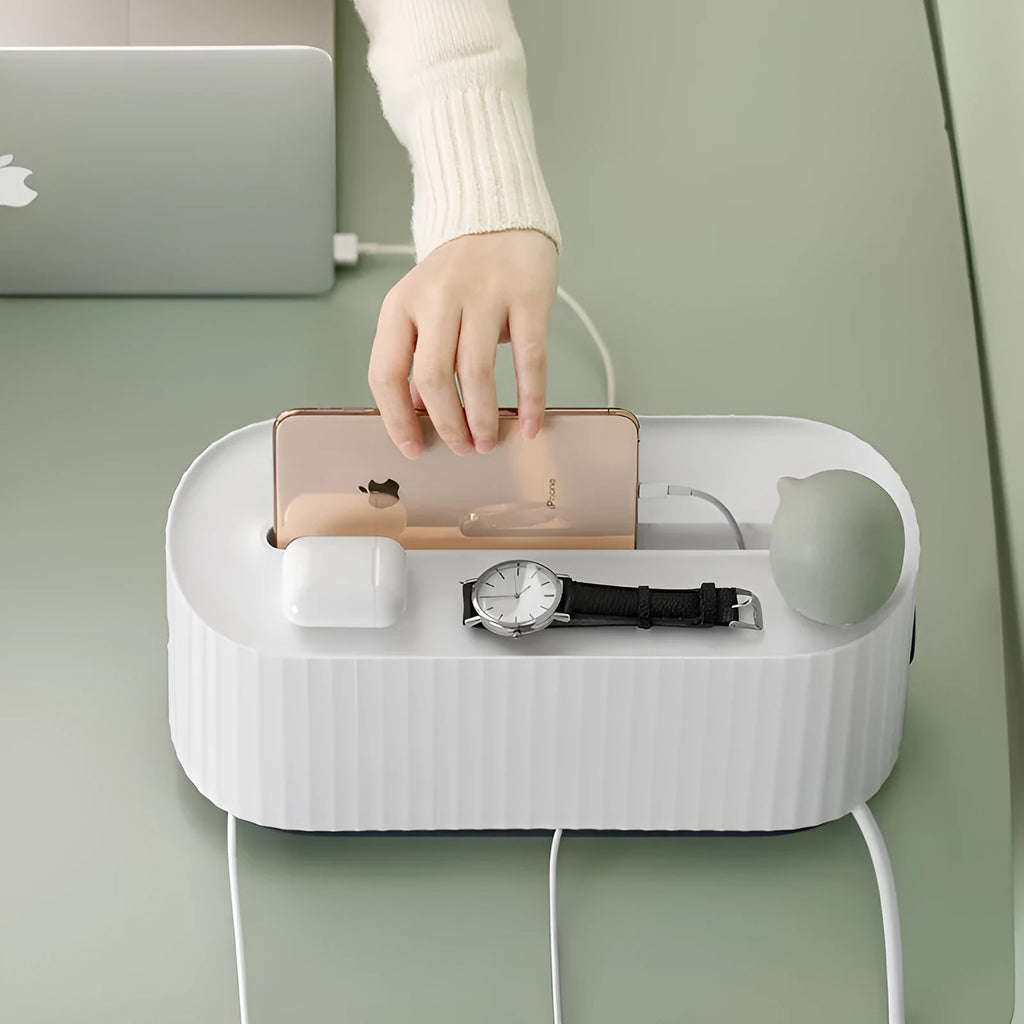 Blue and white power strip storage box with lid open showing cable holes and phone slot.