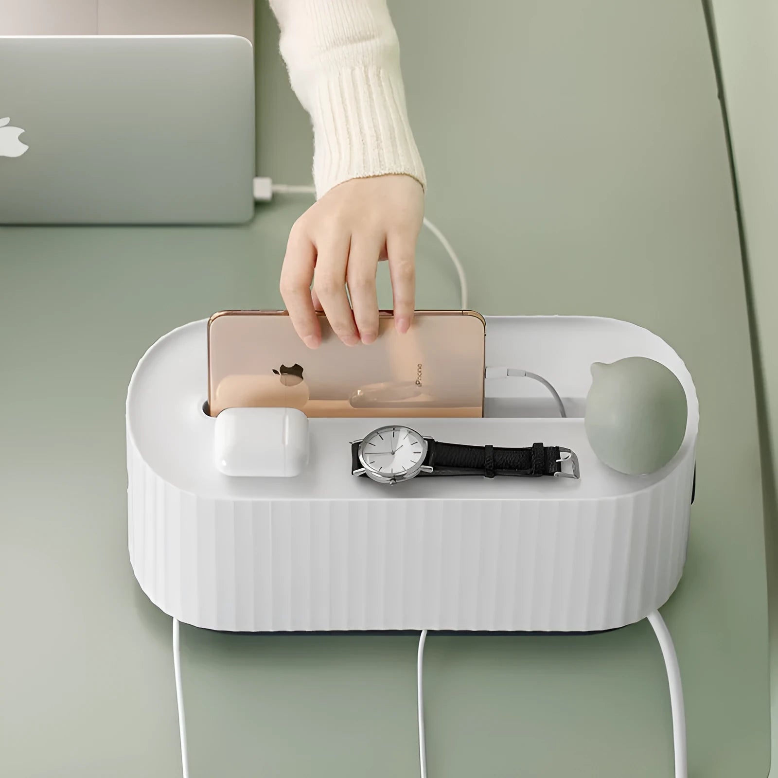 Blue and white power strip storage box with lid open showing cable holes and phone slot.