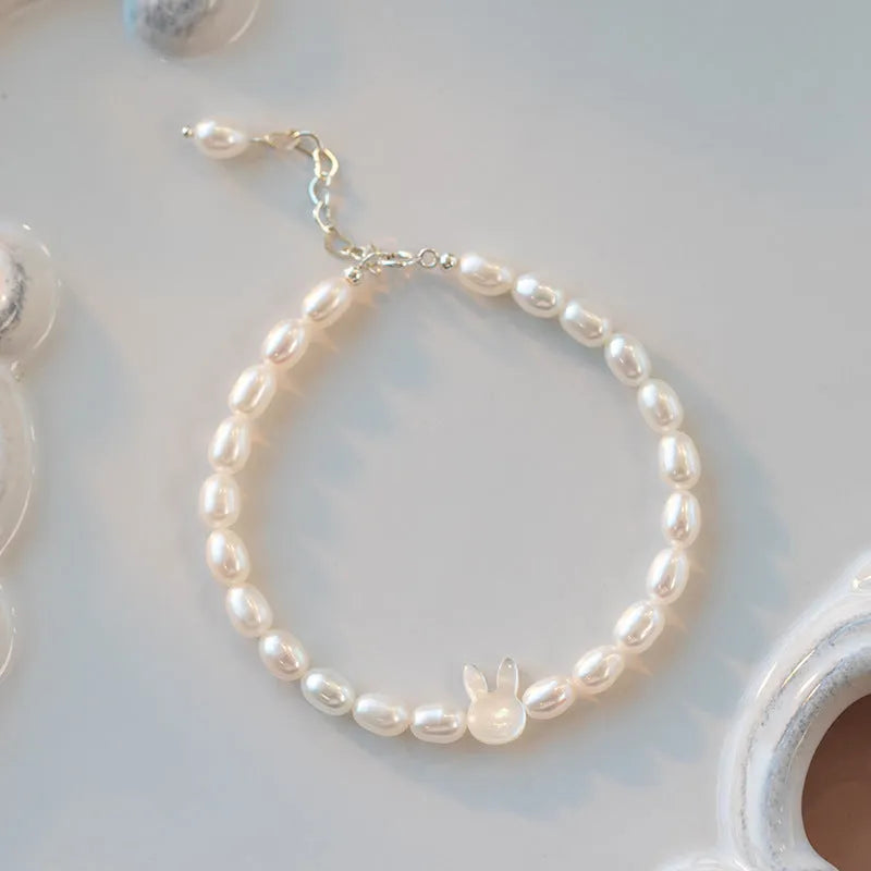 Handmade white shell pearl bracelet with 925 silver rabbit charm on 16cm elastic cord