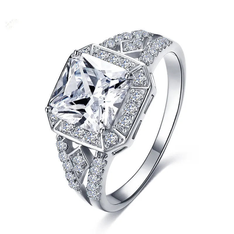 Women's geometric ring with hollow design and inlaid zircon stone in platinum colour.