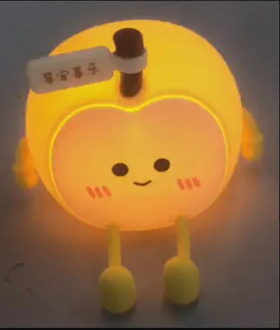 Qian'an Xile night light with geometric stereo design, USB charging, and yellow LED glow on a desktop
