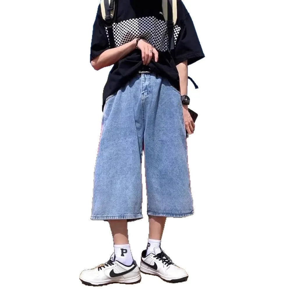 Blue washed denim pirate shorts for men with a high waist, cropped length, and straight legs on a zipper fly.
