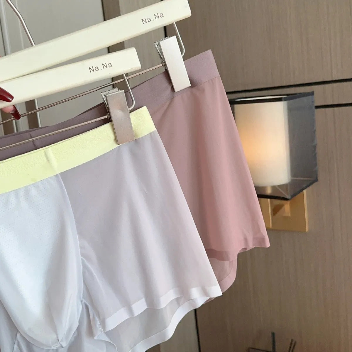 Ultra-thin seamless men's ice silk boxers with a honeycomb crotch panel, shown in multiple colours.