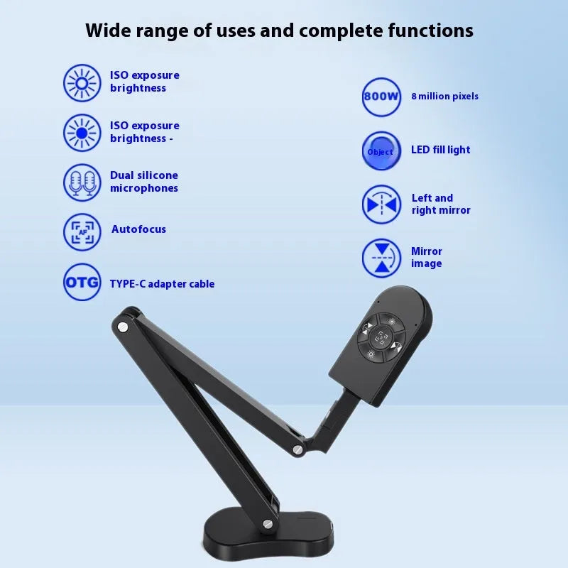 USB computer webcam with built-in microphone on a desk next to a monitor
