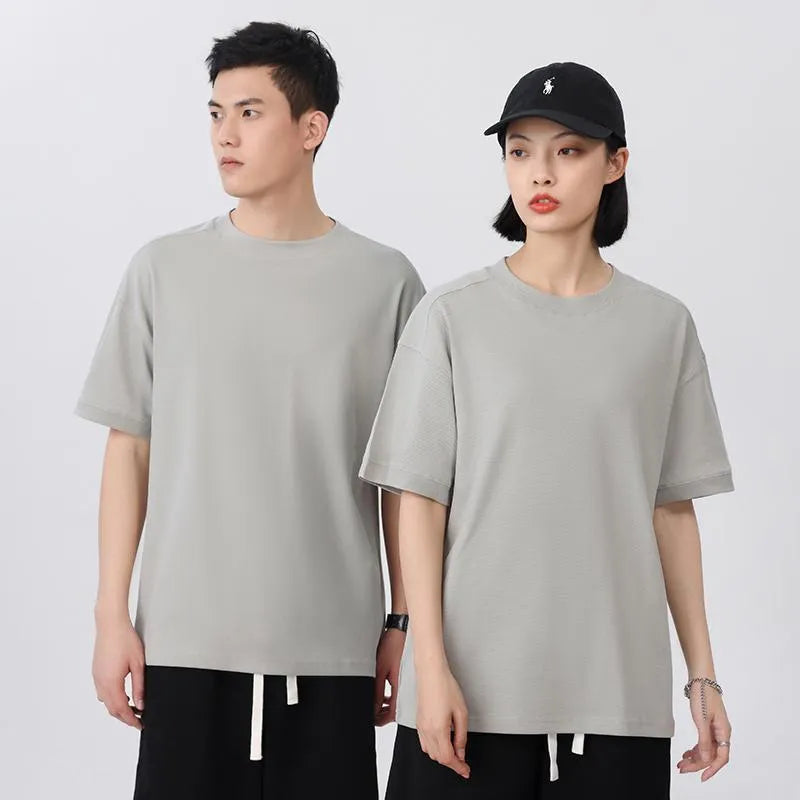 Short-sleeved loose-fit cotton pique T-shirt for youth in solid colour options