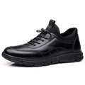 Black men's casual leather shoes with round toe and square low heel on a rubber sole.