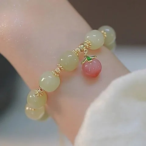 Peace buckle bracelet with rabbit motif, glass and coloured glaze beads