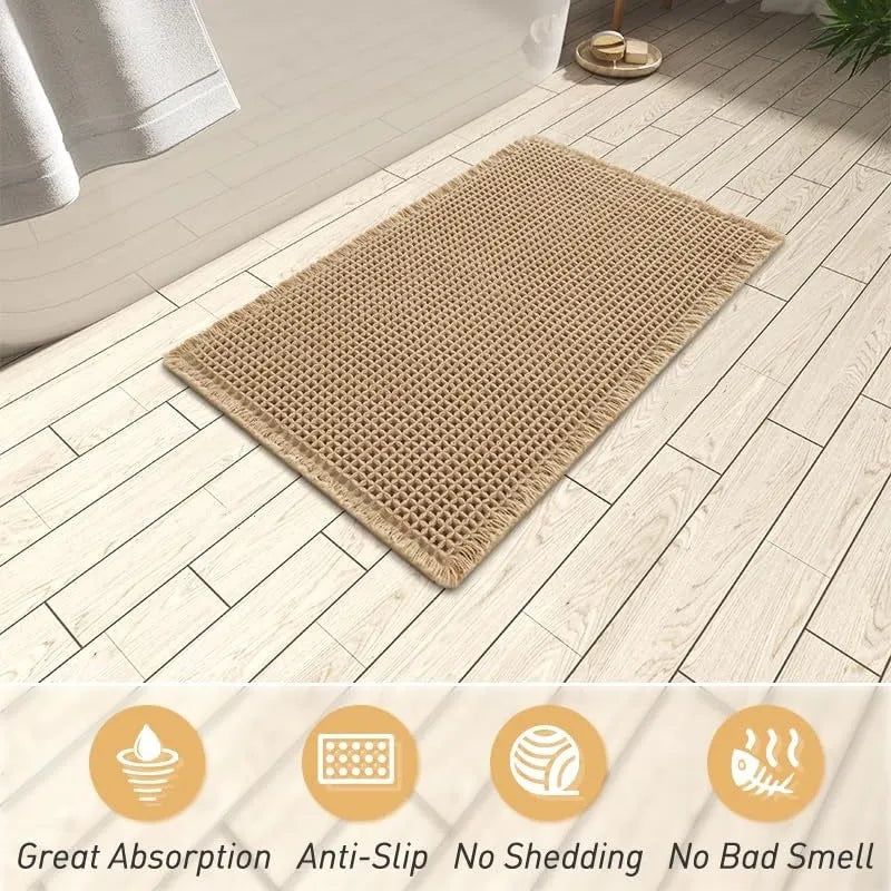 Checkered non-slip polyester bathroom floor carpet in a neutral colour on tiled floor.