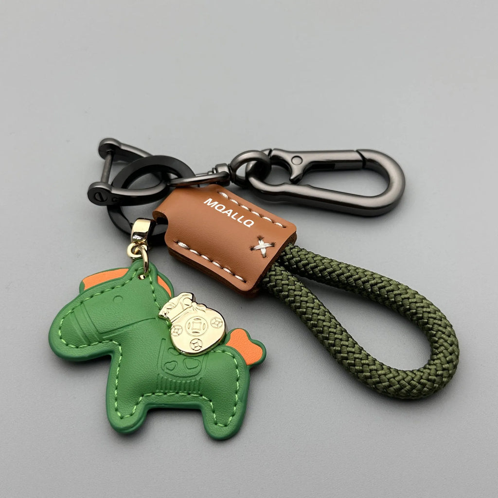 Handmade brown cowhide key ring pendant with a zinc alloy pony buckle on a green flanelle rope.