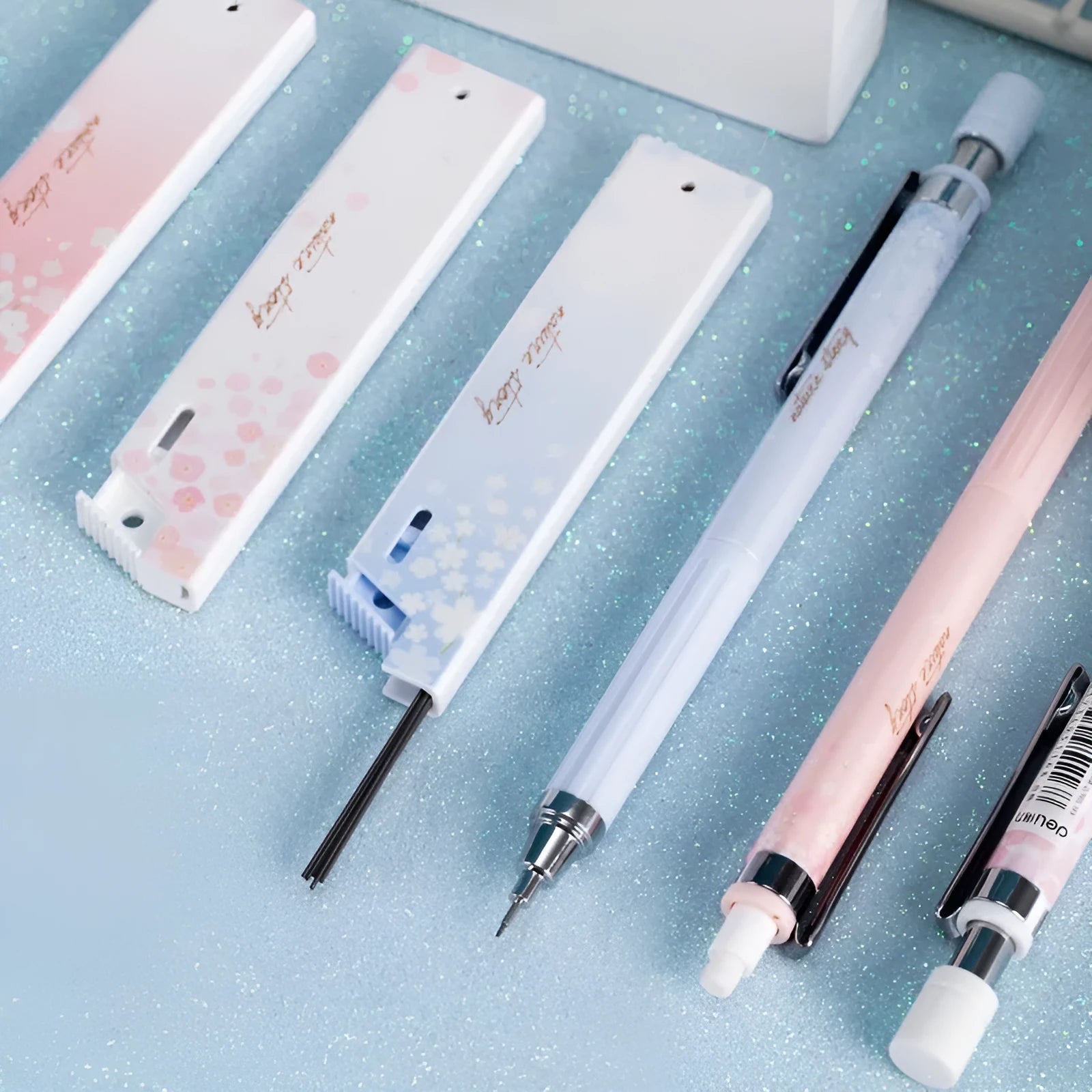 Mixed colour Sakura law pattern 0.5mm automatic pencil set with three pencils and three refill boxes.