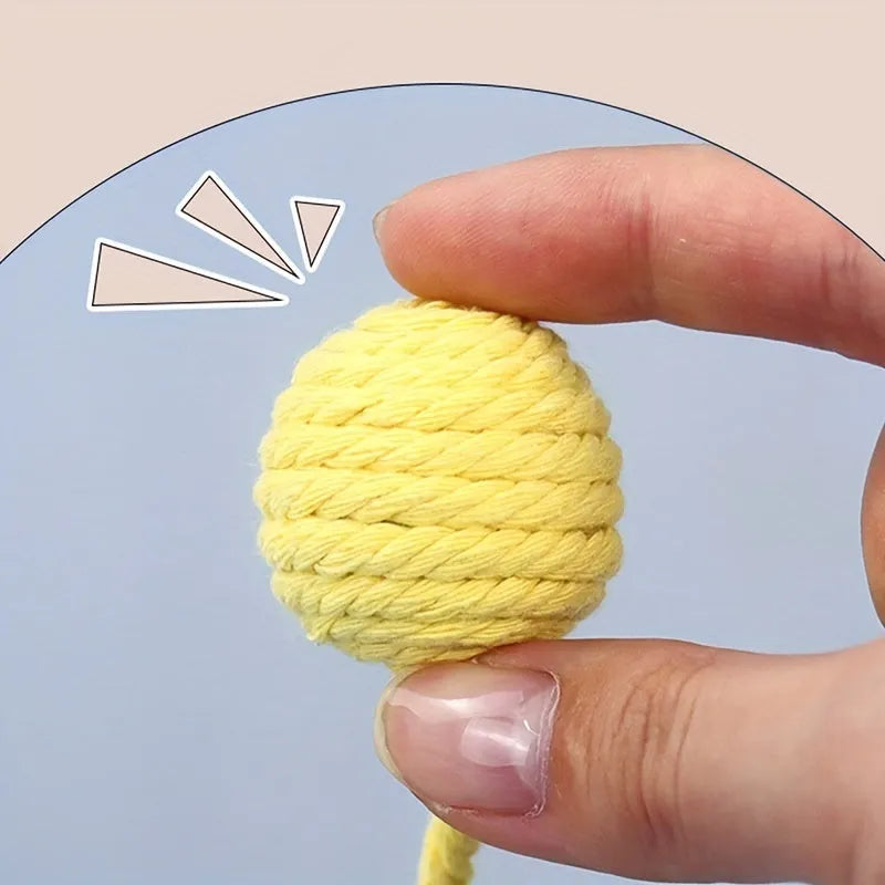 Cat toy ball with attached rope in green, pink, purple or yellow colours showing 3cm and 6cm size options