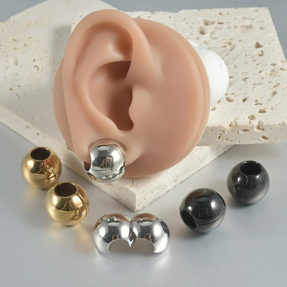 Stainless steel hollow skull and Buddha head geometric earrings for men and women.